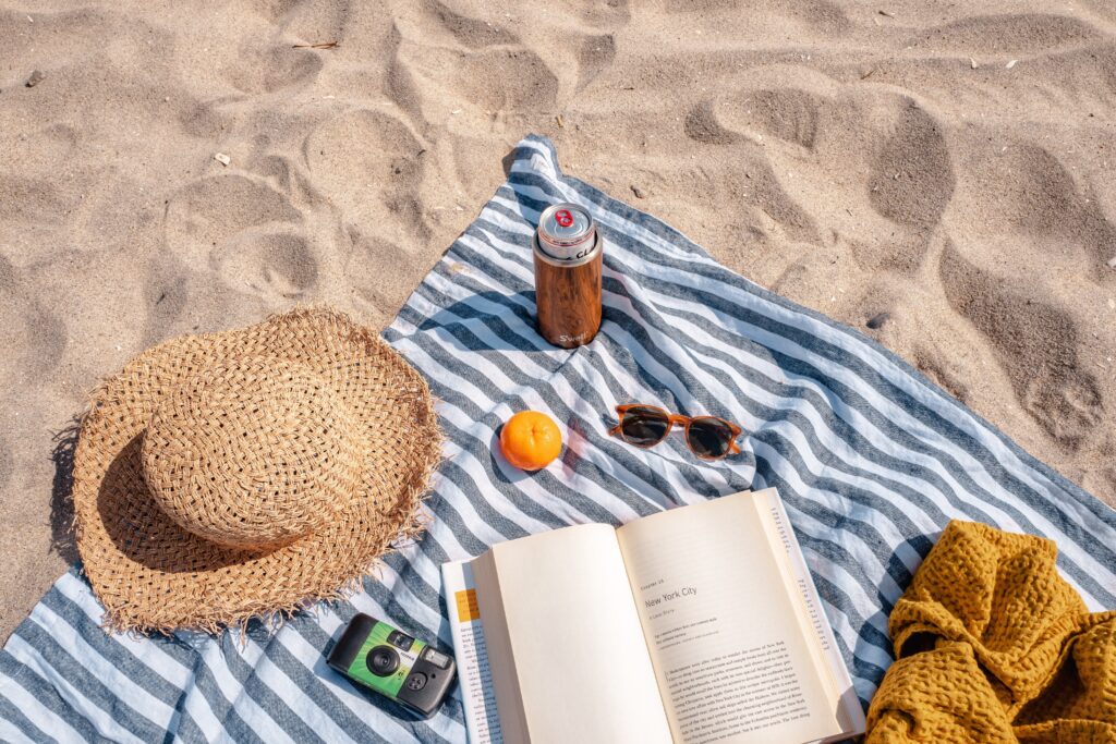 beachwear for panama climate on a towel by the beach